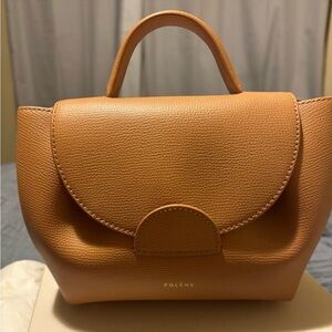 Numéro Un Nano
EDITION TEXTURED TAN Comes with dust bag and box